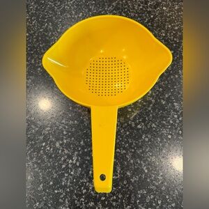Vintage Tupperware 1 quart Yellow Strainer gently used.